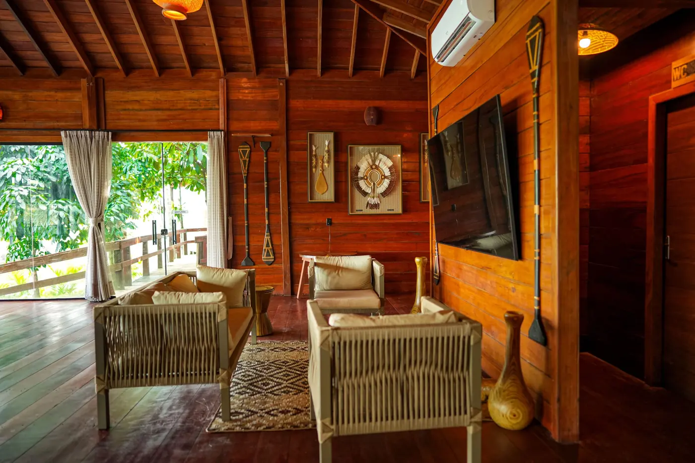 A wooden suite with beds and a view of the river